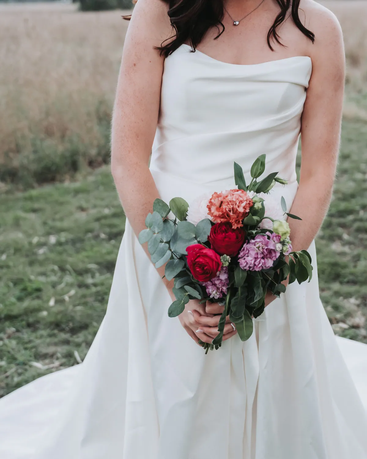 Kayla's bouquet against her gown