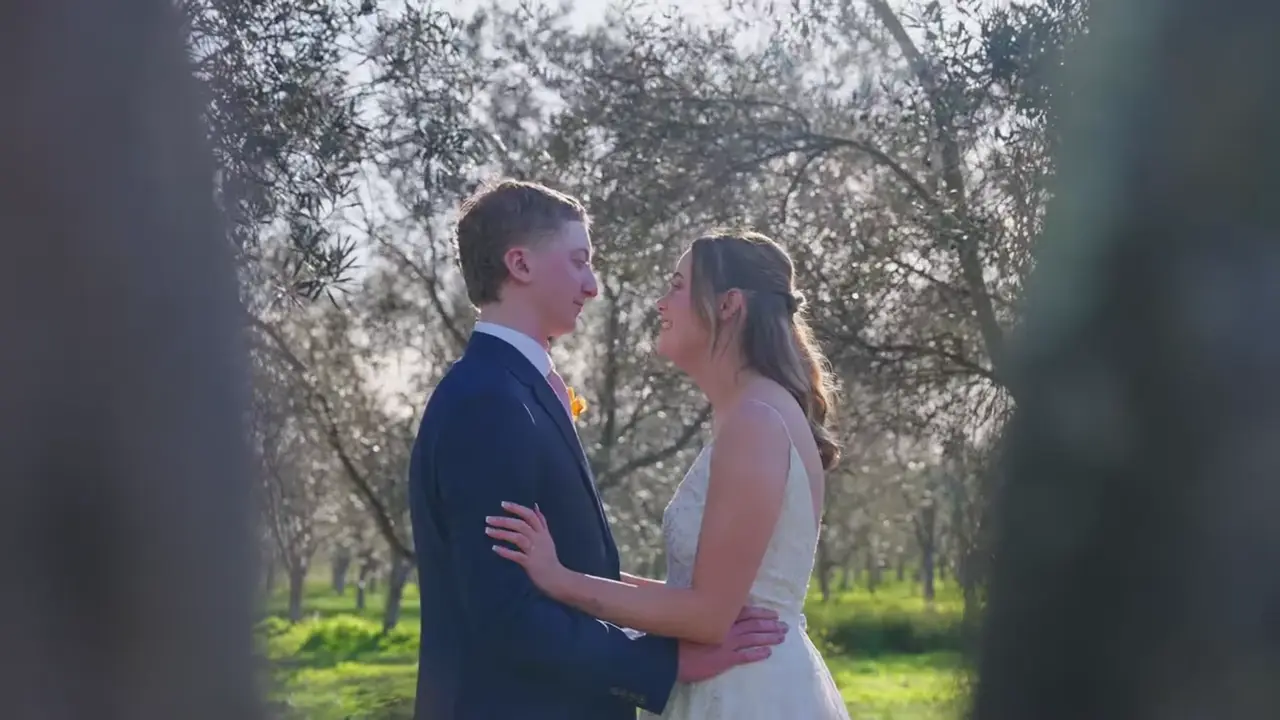 Chloe and Jack at golden hour among the olive trees at Mount Duneed Estate